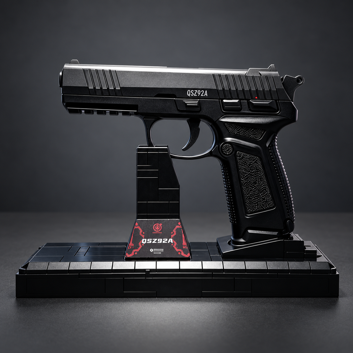 E&L Jianshe QSZ92A black non-firing building block model with its original display stand on a charcoal background