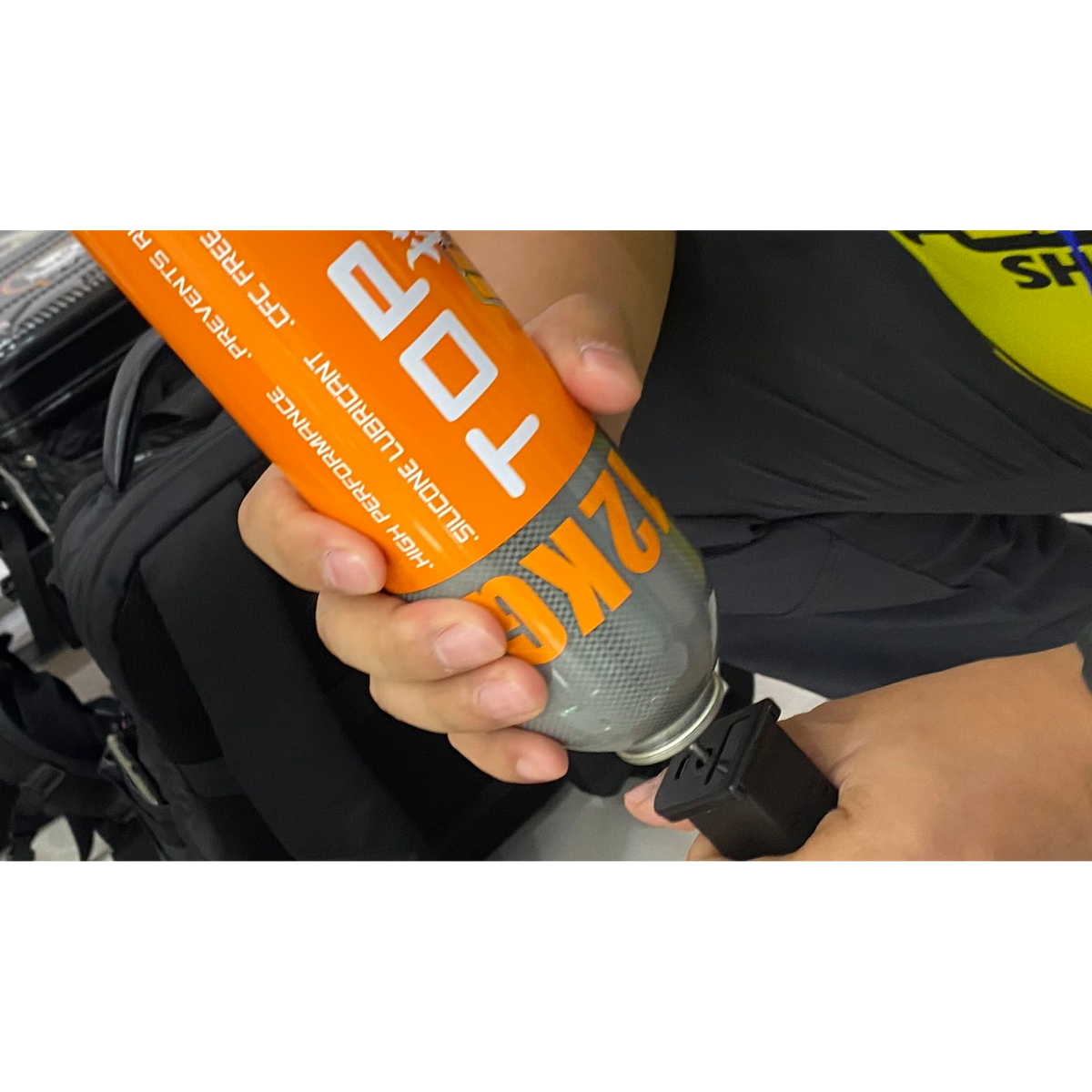 Ultraforce Top Gas 12KG being used to refill a gas magazine